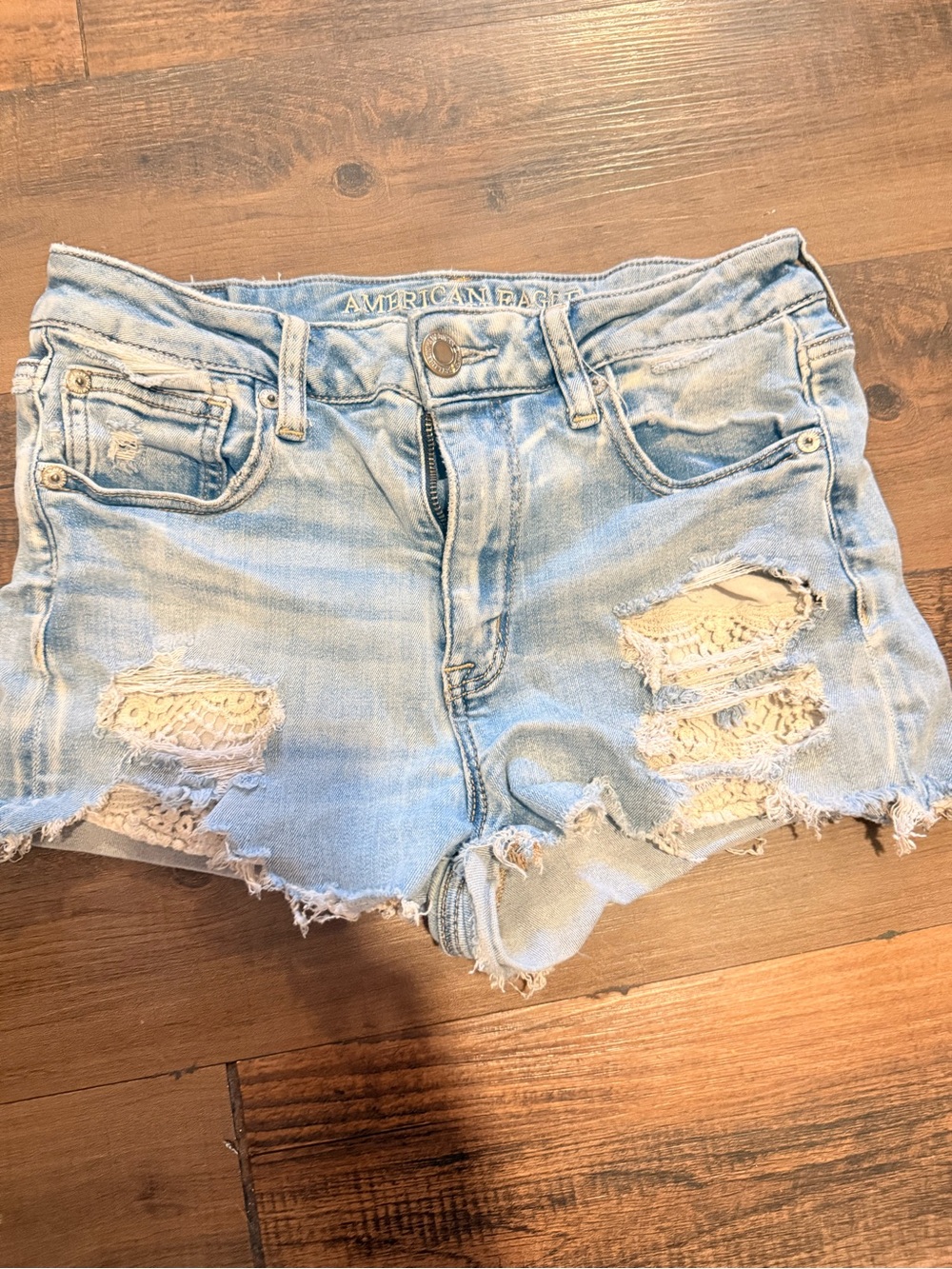 American Eagle Outfitters Light Wash Distressed Denim Shorts with Lace